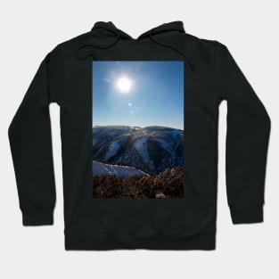 Sun on the mountainside in winter Hoodie